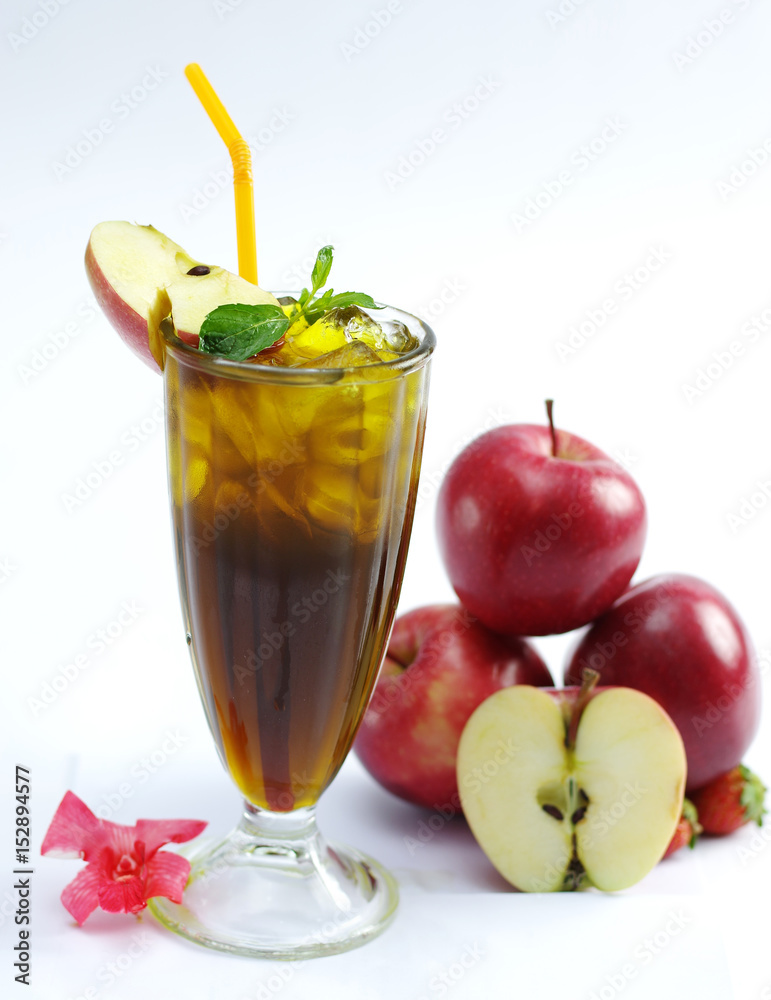 Glass of fresh apple tea with mint leaf on white background Glass of fresh apple tea with mint leaf on white background