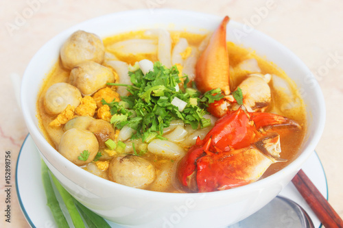 Vietnamese noodle with crab and mushroom or banh canh cua in white bowl