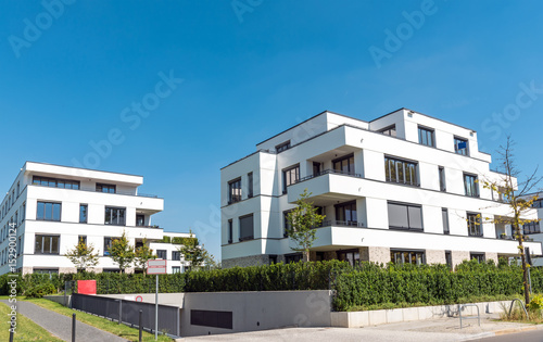 White modern multi-family houses seen in Berlin, Germany © elxeneize
