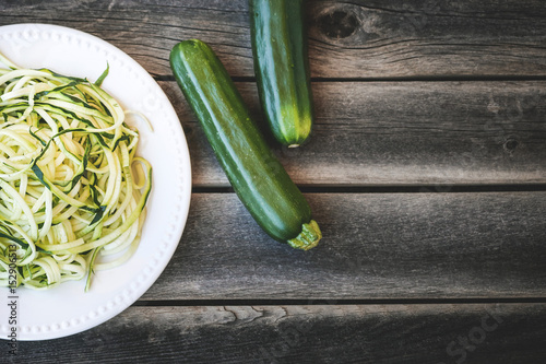Zucchini Noodles over a wooden table
