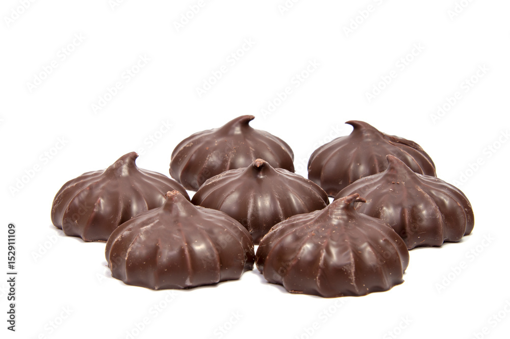 Pile of marshmallows glazed with chocolate. Many coated elegant zephyr dessert isolated on white. Sweet elegant dessert on a plate Pile of marshmallows glazed with chocolate. Many coated elegant zephyr dessert isolated on white. Sweet elegant dessert on a plate