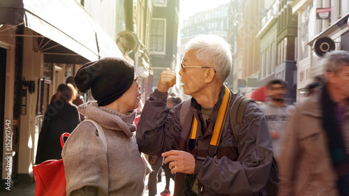 Asian senior couple lost in Europe. Travel after retirement and get confuse during the trip