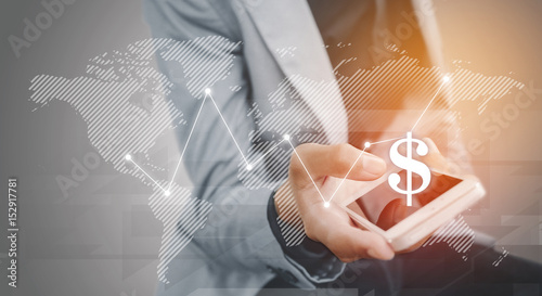 Businessman holding the phone virtual graph on the screen map point with dollar, blank copyspace area for text or slogan, against grey background
