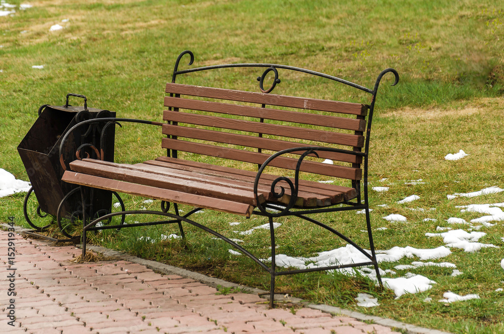 Forged bench and urn in the park