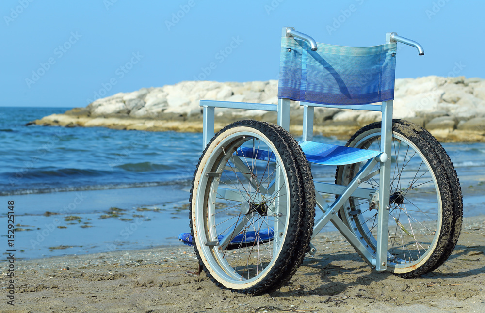 Fototapeta premium Special wheelchair with aluminum tubes to enter into the sea