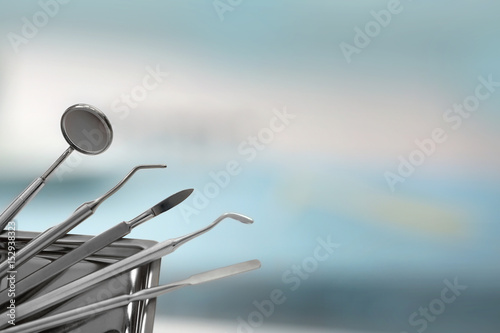 Dental tools on blurred background