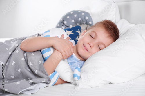 Little boy with toy whale s...