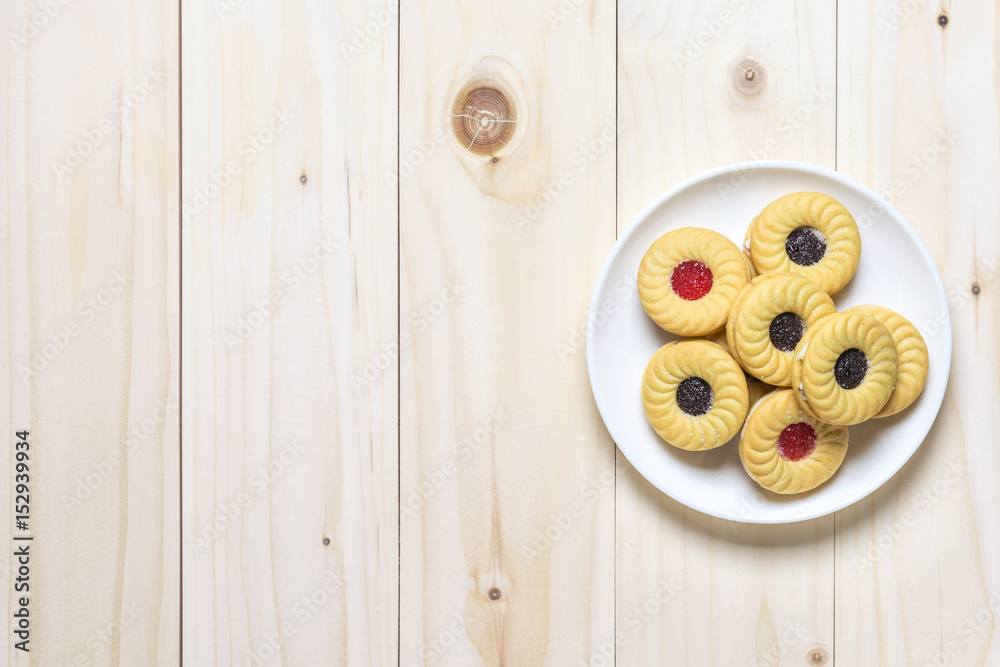 Cookie biscuits on wooden table, flat lay