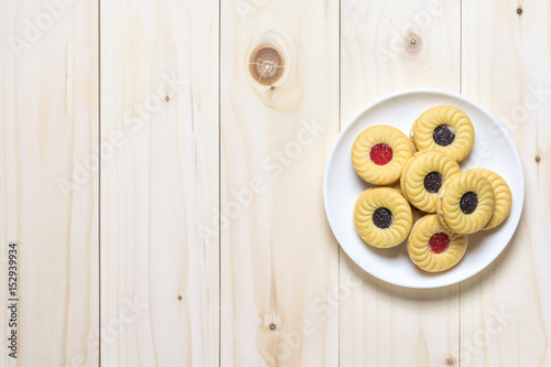 Cookie biscuits on wooden table, flat lay