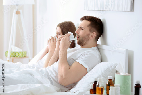 Ill couple in bed