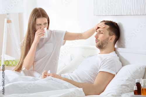 Ill couple in bed