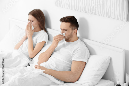 Ill couple in bed