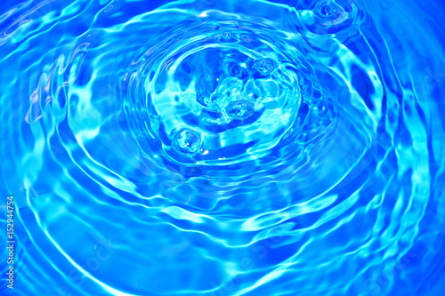 Abstract of water droplets on blue background.