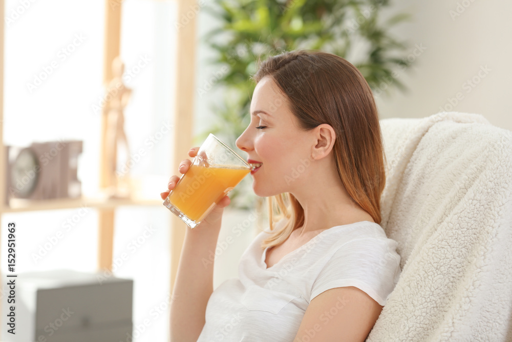 Beautiful woman drinking fresh juice at home Beautiful woman drinking fresh juice at home