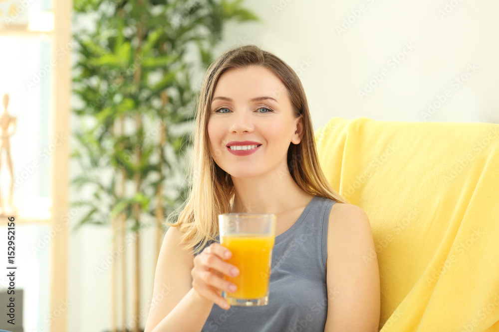 Beautiful woman with glass of fresh juice at home Beautiful woman with glass of fresh juice at home