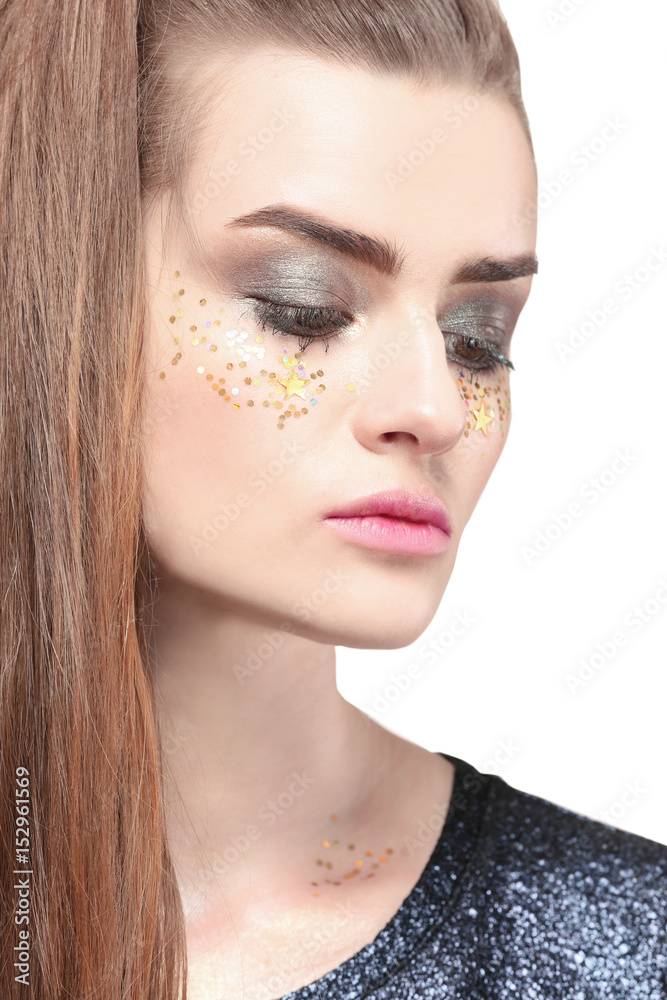 Beautiful young woman with creative make up on white background Beautiful young woman with creative make up on white background