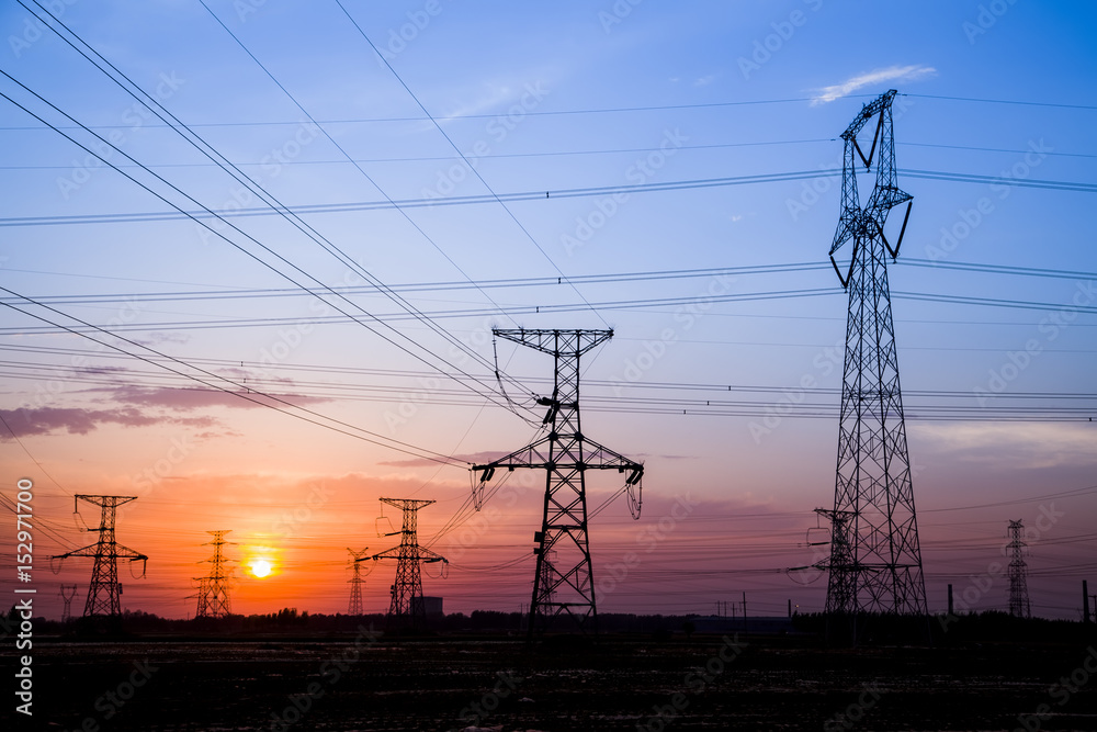 Fototapeta premium The silhouette of high voltage towers