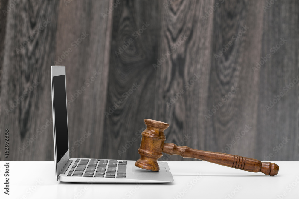 Laptop And Mallet On Table