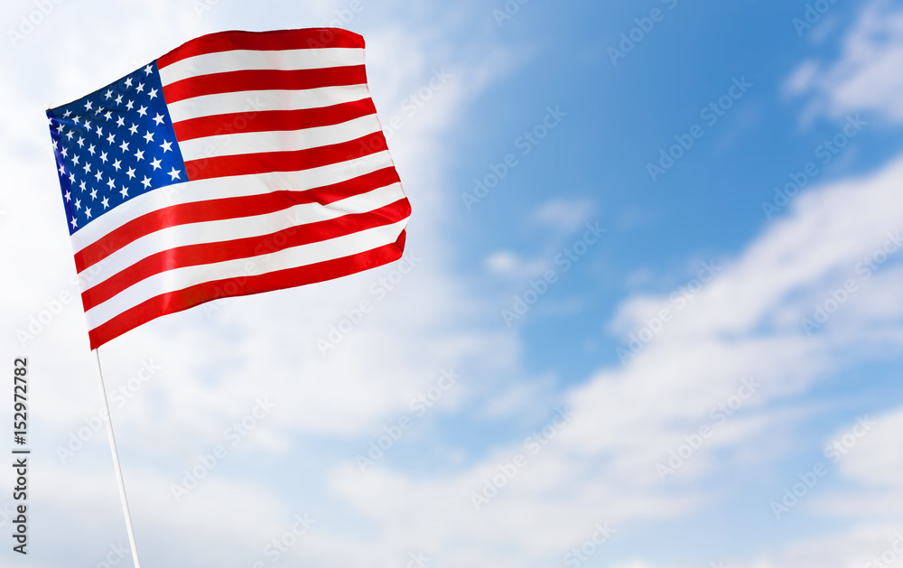 Obraz premium American flag against blue sky