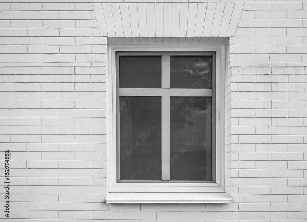 Modern plastic window of brick building