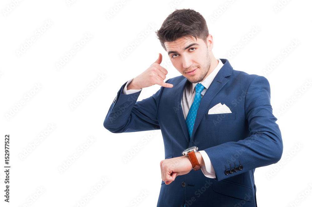 Salesman doing call gesture and showing his watch
