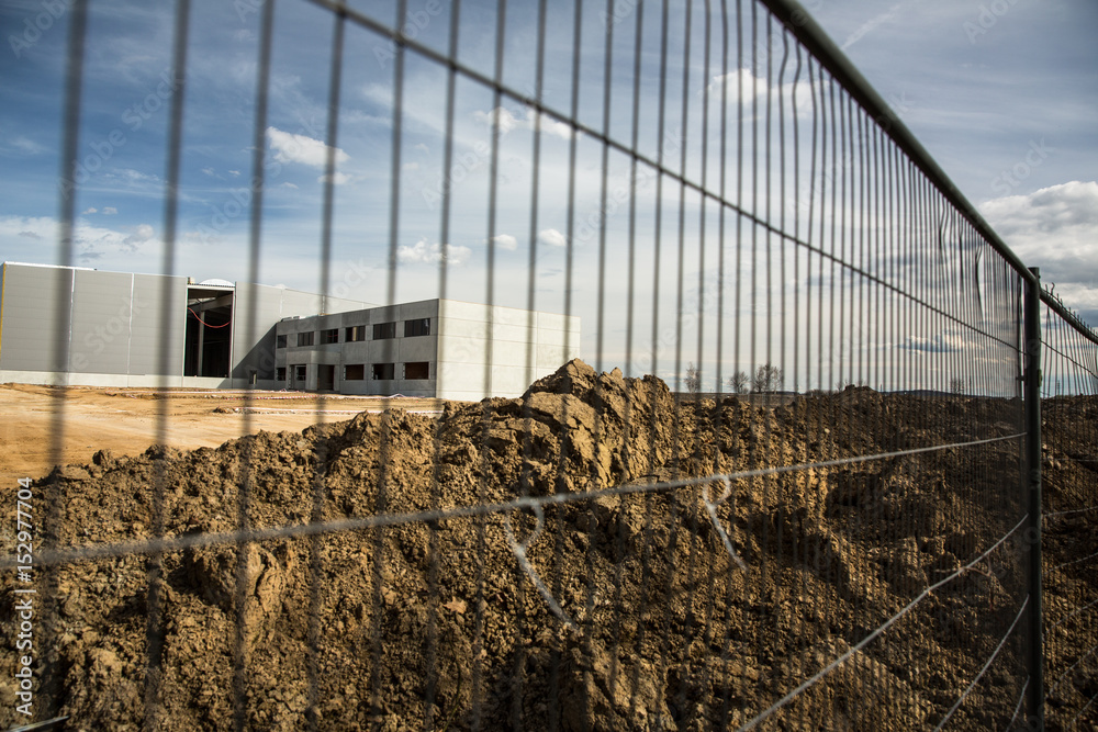 Fototapeta premium Construction site with a fence around it