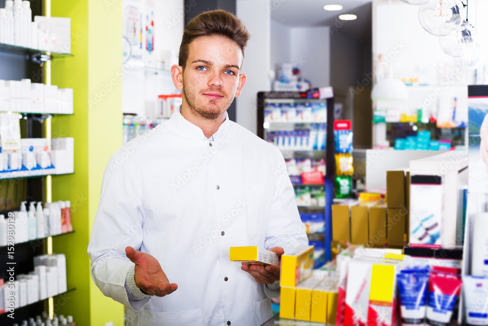 Fototapeta premium Man druggist in pharmacy