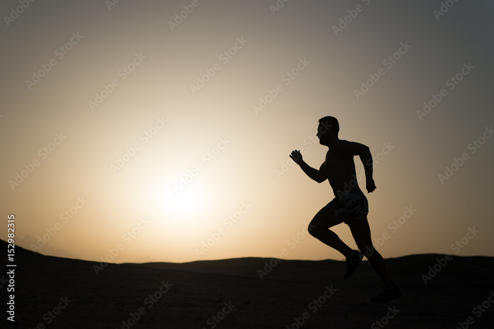 silhouette or man runner, guy running outdoor at clear sky