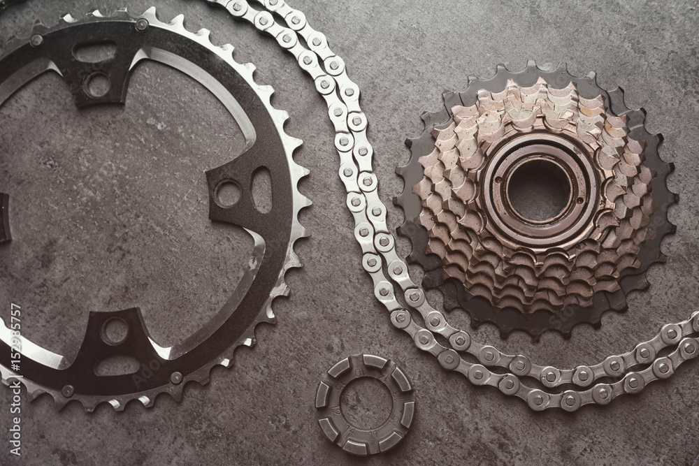 Bicycle parts on gray background