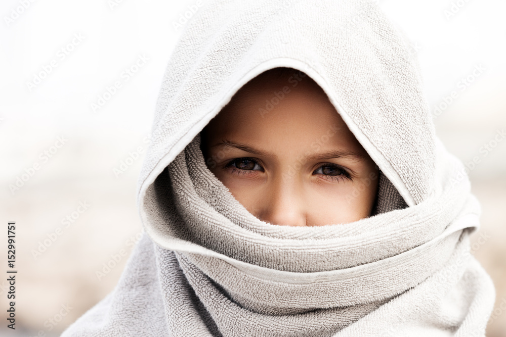 Fototapeta premium Little child boy wearing arabian burka style clothing