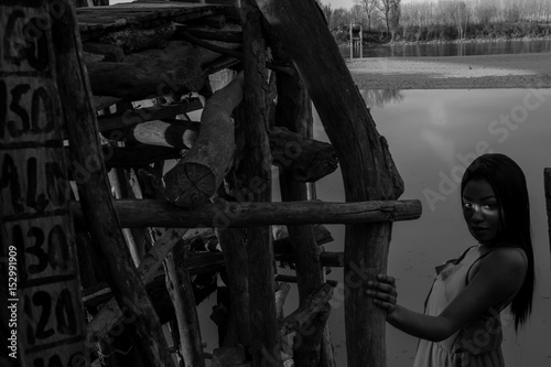 The river's level. Black model standing next to the river height meter. © michaelgalli