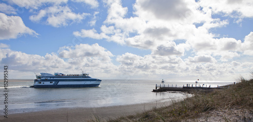 Ferry to the island of Vlieland Netherlands. Waddenzee. Nort Sea coast. Clouds. Summer. photo