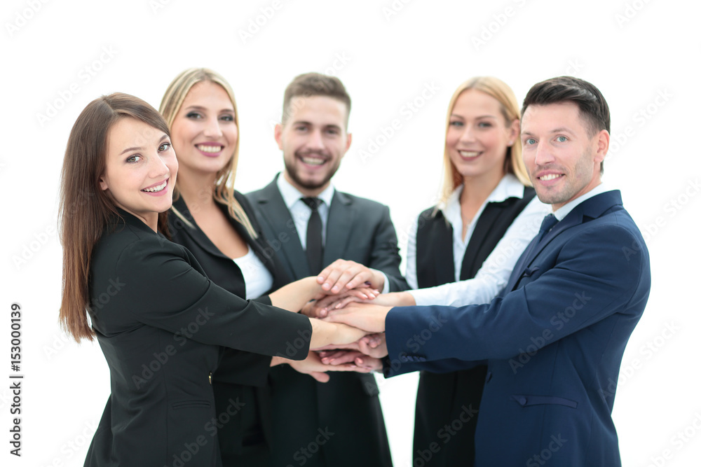 Happy business team showing unity with their hands together Happy business team showing unity with their hands together