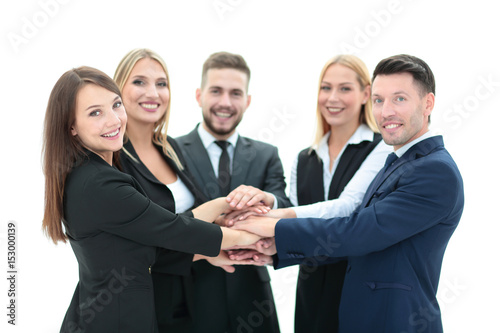 Happy business team showing unity with their hands together