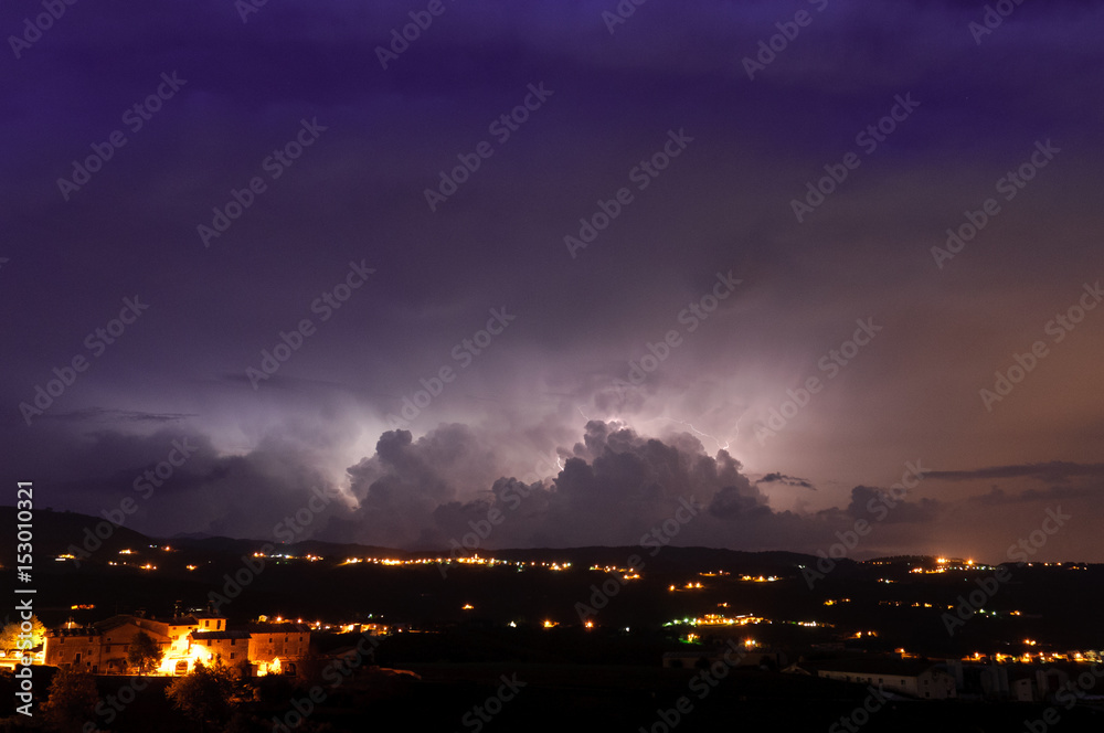 Thunderstorm behind the clouds