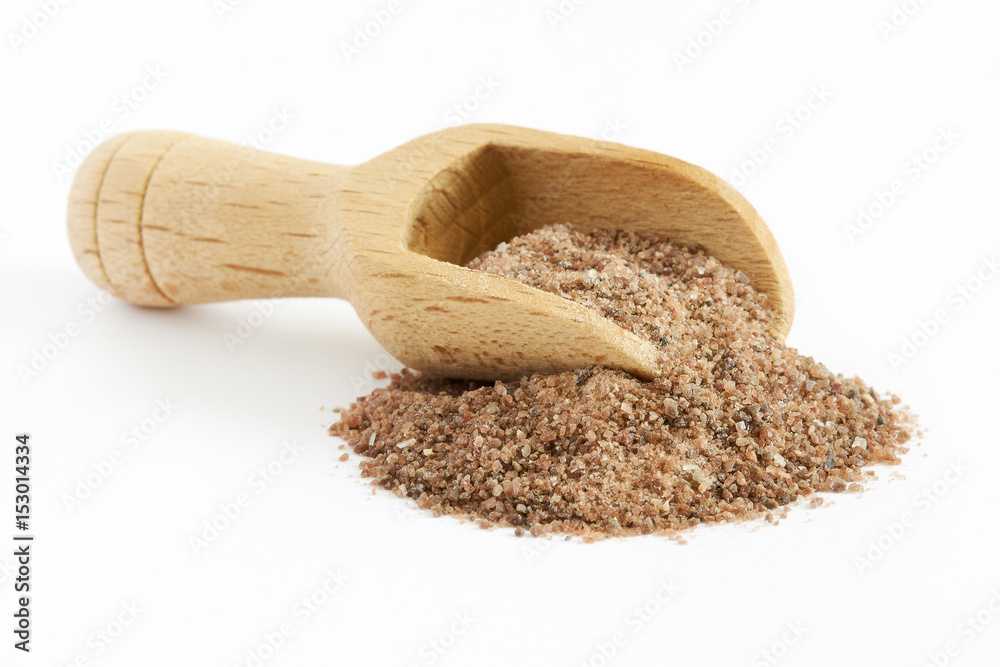 Himalayan black salt (Kala namak) with wooden scoop isolated on white  background Stock Photo