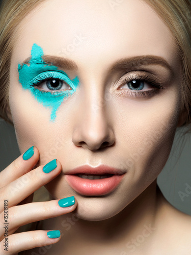 Portrait of young beautiful woman with fashion make up