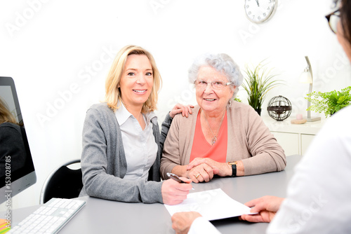 Photos elderly senior woman with daughter signature legacy heritage testament document