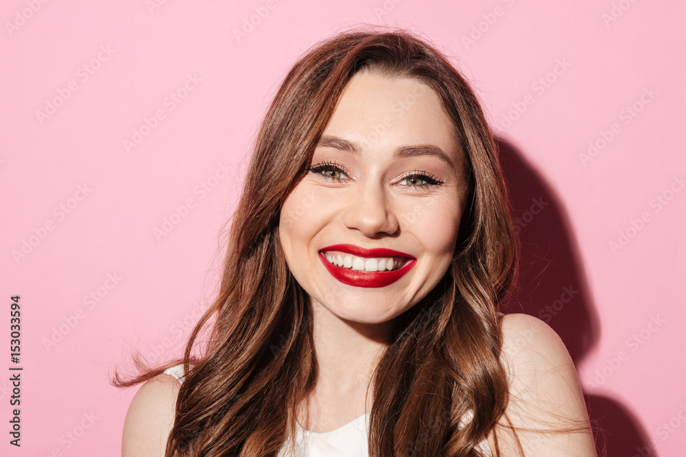 Smiling young brunette lady looking at camera Smiling young brunette lady looking at camera