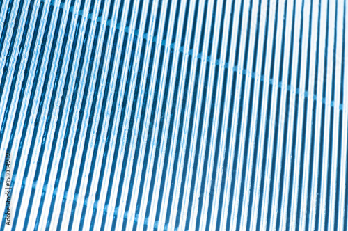 Abstract metallic blue background with stripes