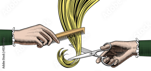 Woman's hands cutting and combing hair