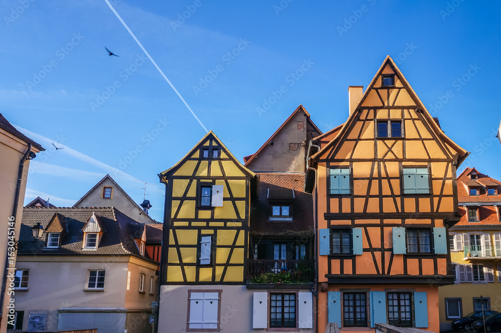 View of colorful traditional french houses in village of Colmar, France View of colorful traditional french houses in village of Colmar, France