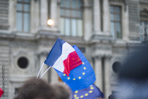 EU flags and France flags shown on a demonstration in Paris. photo