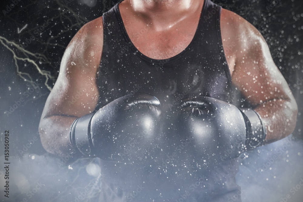 Fototapeta premium Composite image of mid section of muscular boxer