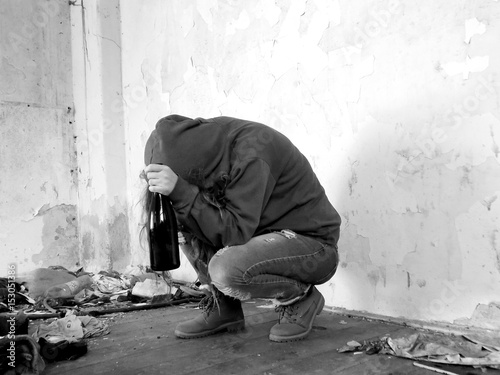 Young alcohollic women with alcohol bottle, alcohol addiction