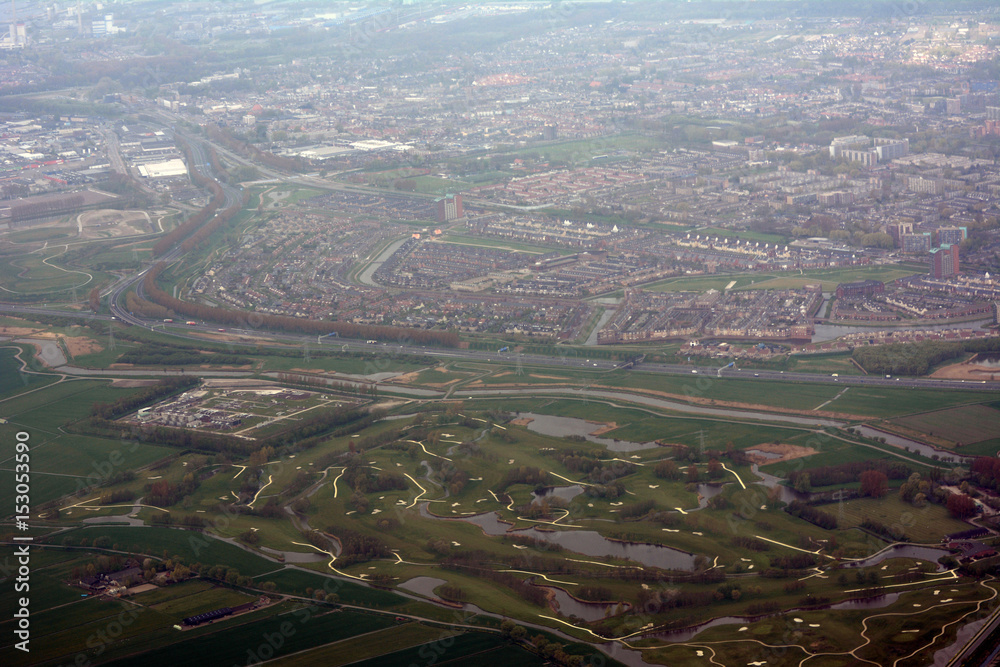 The city of Amsterdam seen from an airplane The city of Amsterdam seen from an airplane