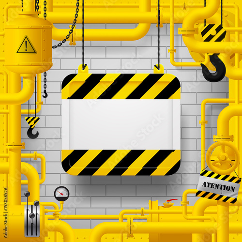 Yellow gas pipes and suspended sign with yellow and black stripes