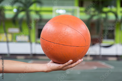 Basketball ball in male hands © issrar