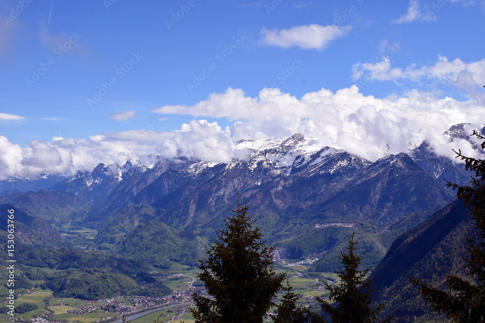 Obraz premium Snow-capped mountains and valley. Beautiful alpine landscape from Rossfeldstrasse panorama road on German Alps near Berchtesgaden, Bavaria, Germany to Austria side of the border.