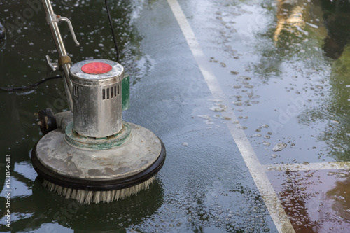 cleaning the floor with polishing machine